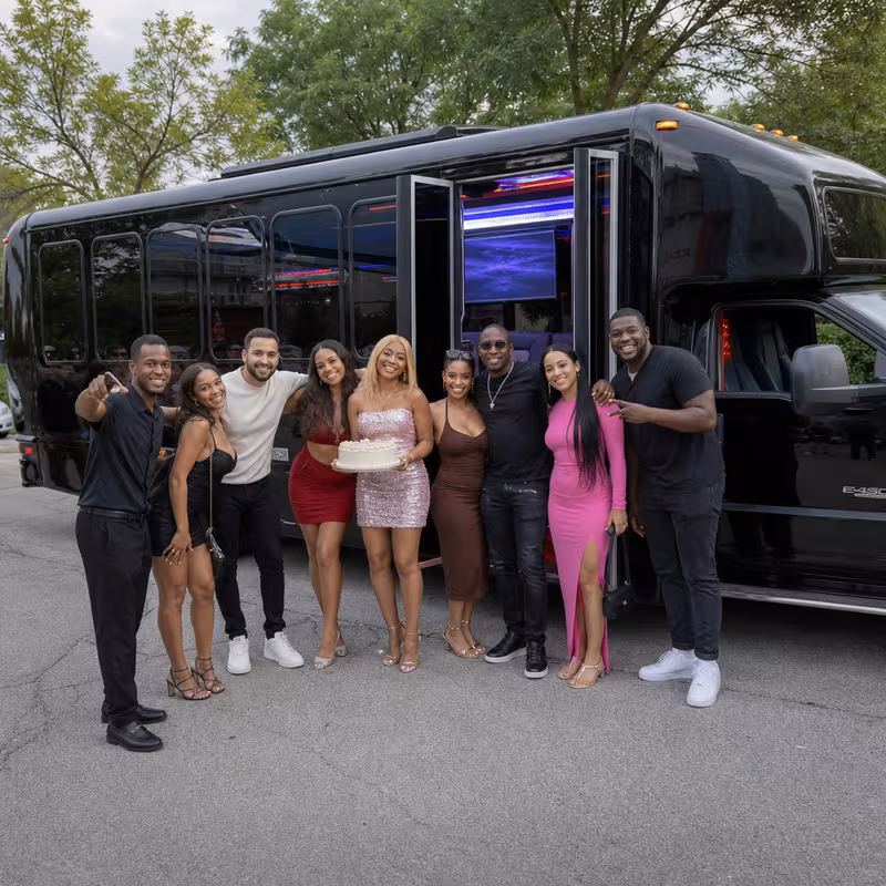 Group boarding a white charter bus for Birthday Transportation transportation in Fort Wayne