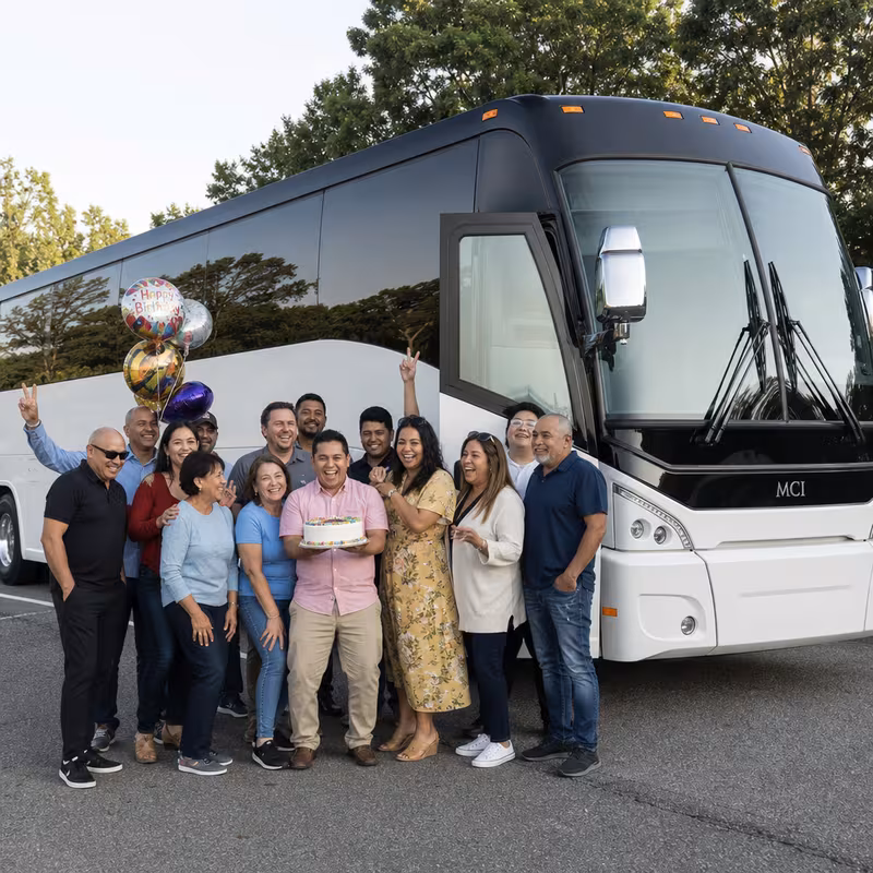 Passengers loading luggage while boarding an Fort Wayne group shuttle