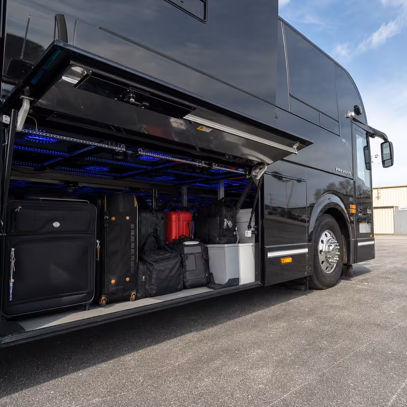 Party bus interior with wraparound leather seating and LED lighting in Fort Wayne